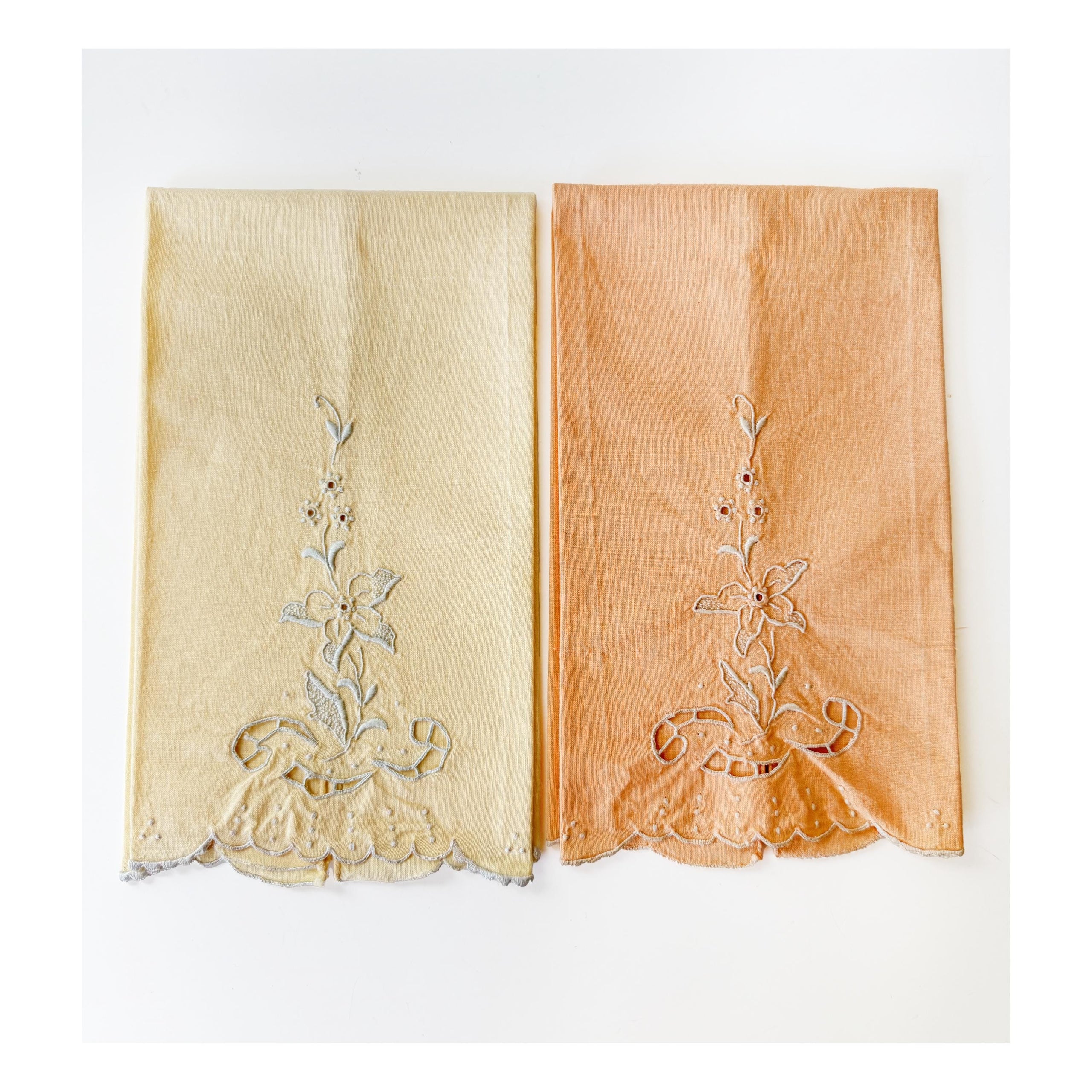 pair of fingertip towels floral embroidered pale yellow and peachy orange