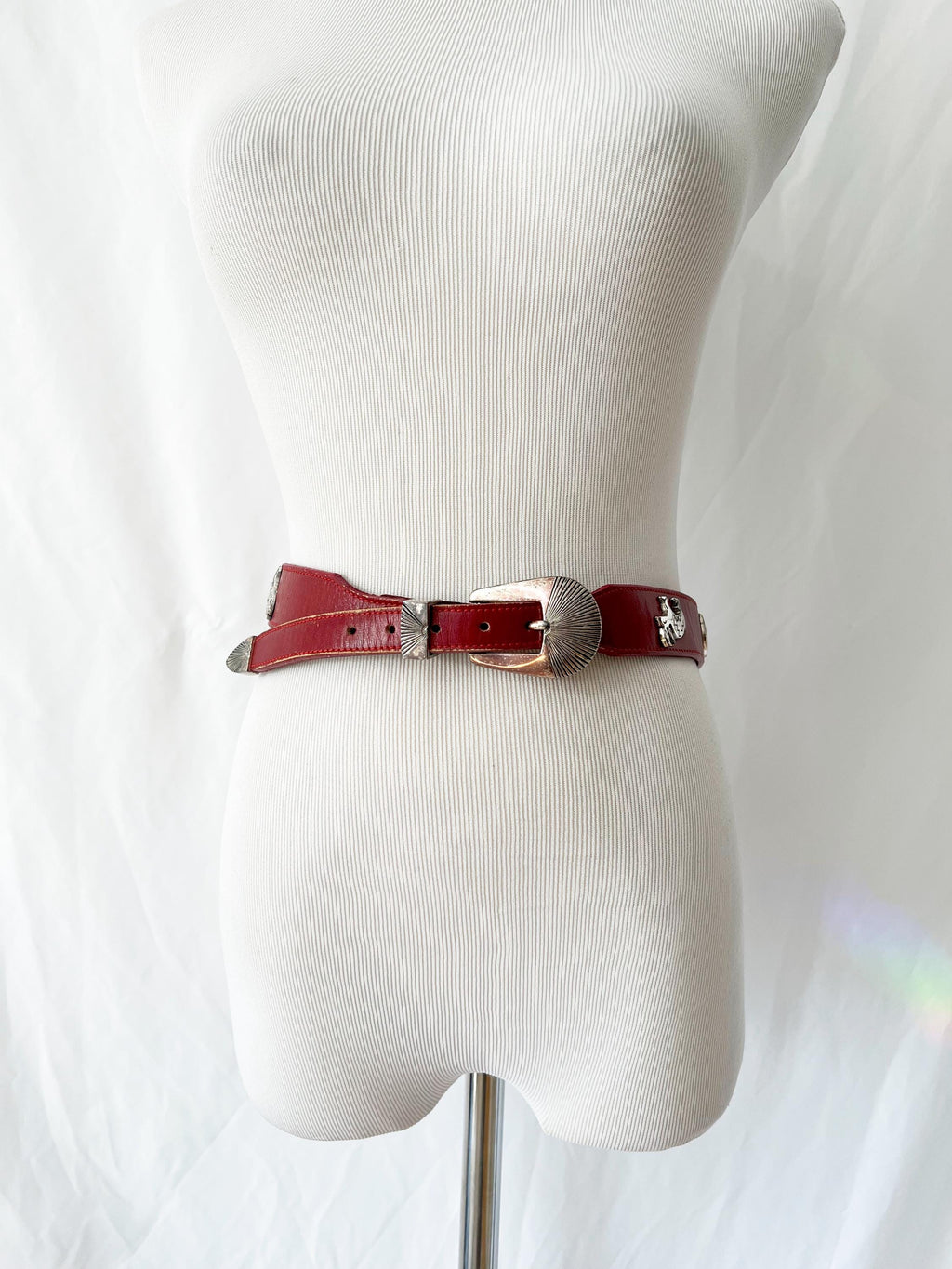 red leather belt with silvertone animals figures  xs